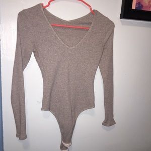 Long sleeve gray bodysuit with snaps to close